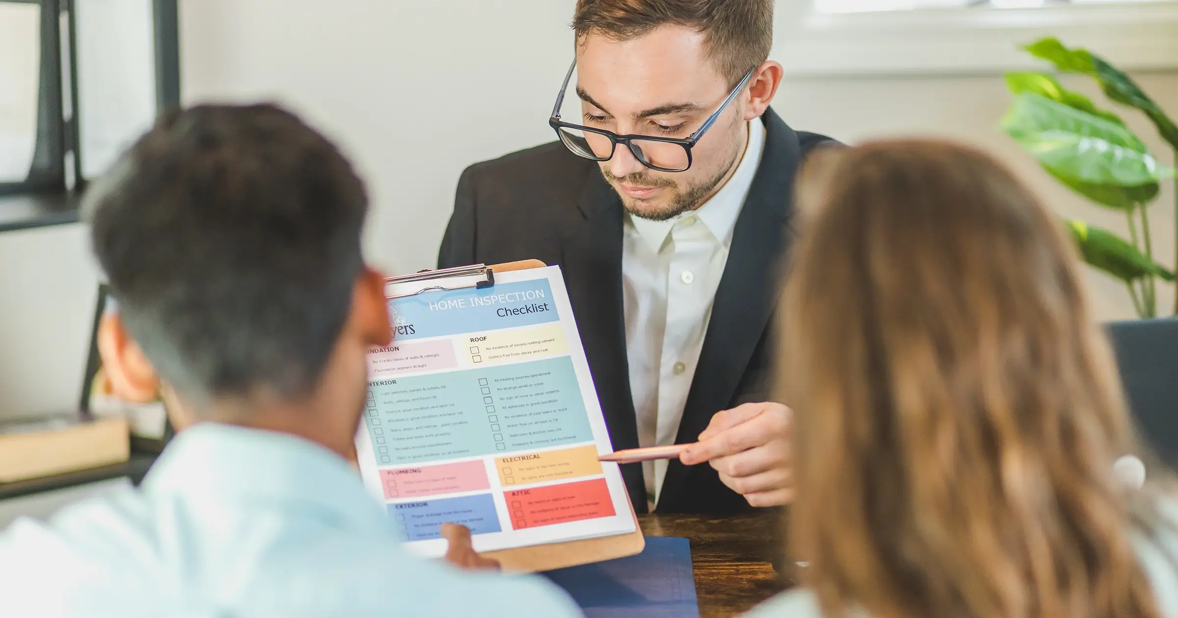 Man presenting to 2 clients