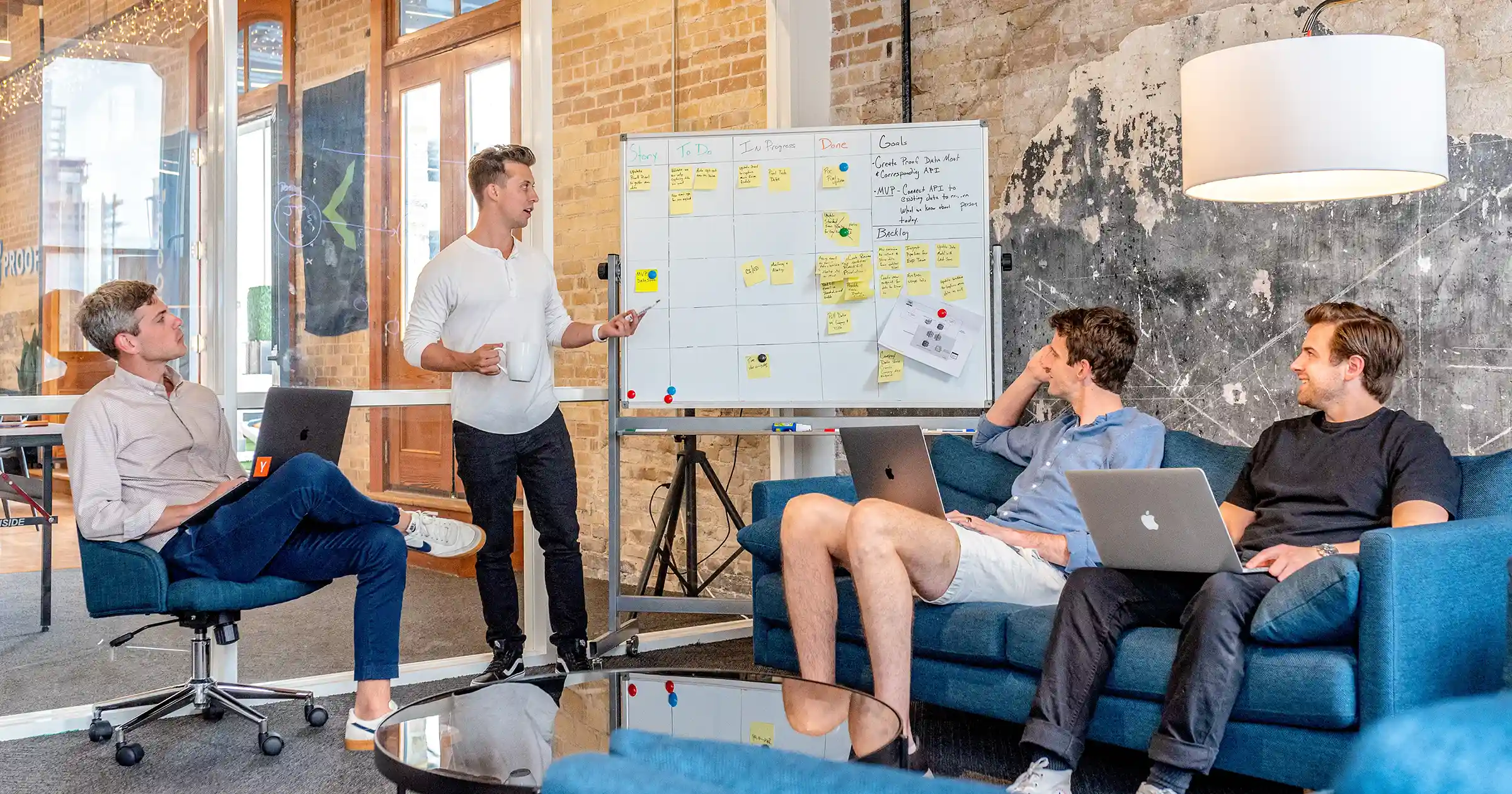 Startup team meeting with a whiteboard