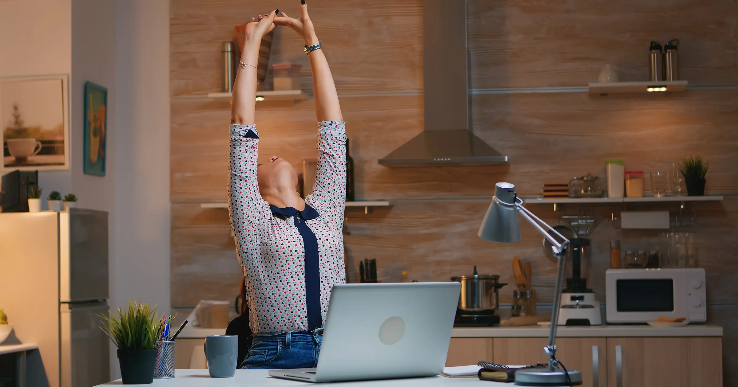 Girl stretching while working from home