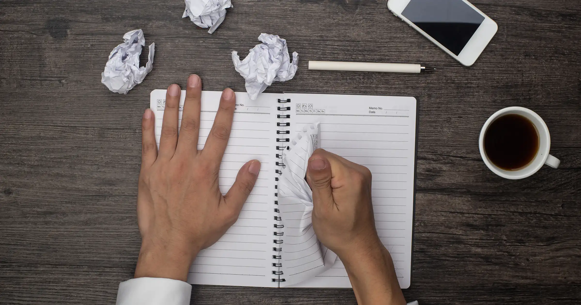 Person tearing up paper and starting again