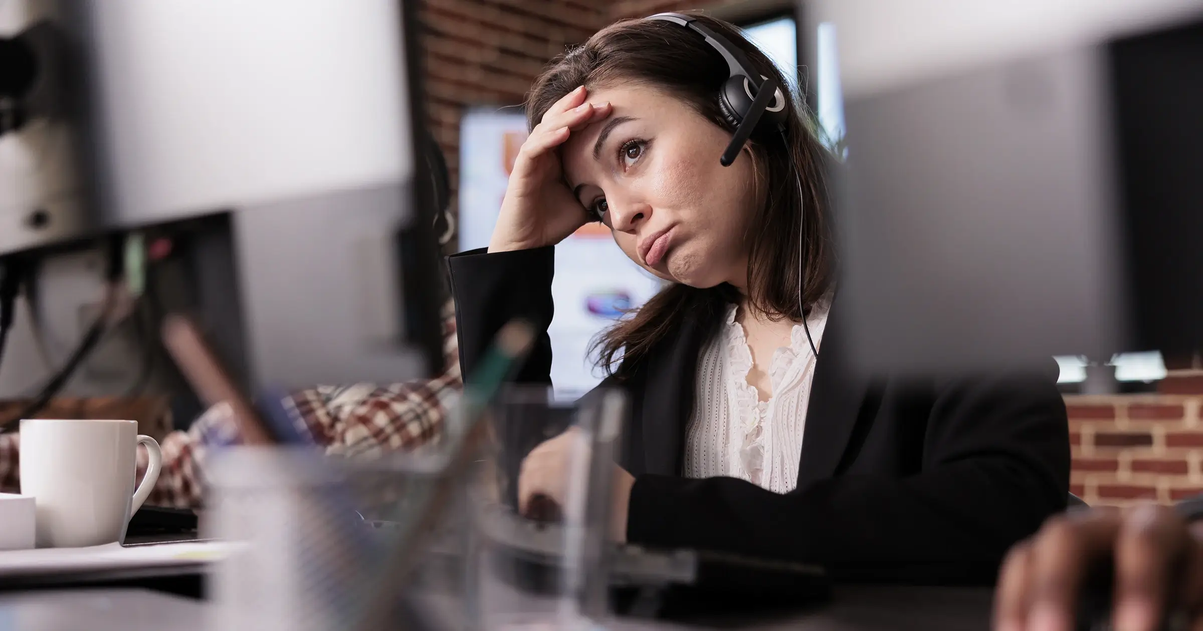 A businesswoman stressed at work