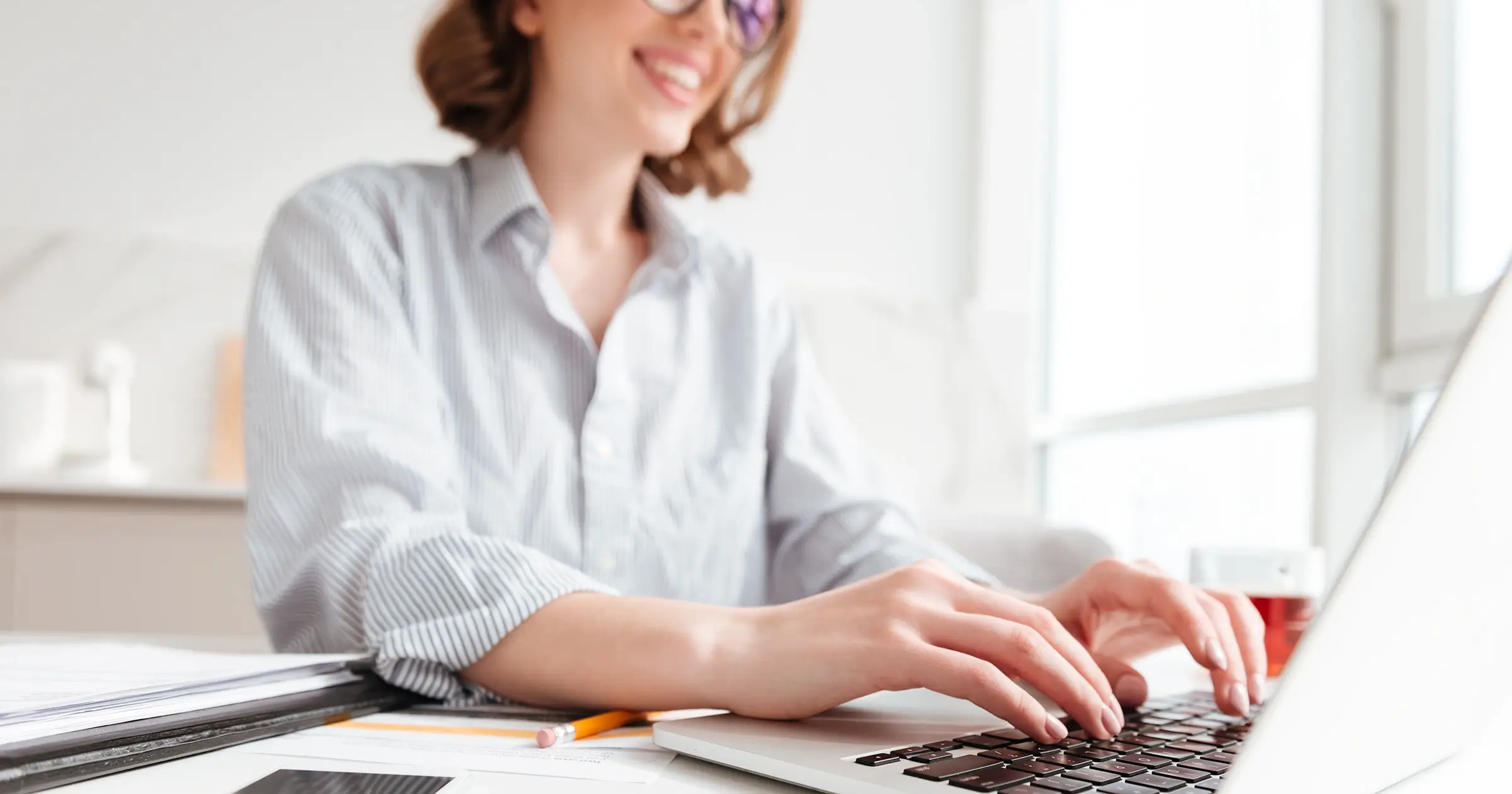 Girl typing on a laptop