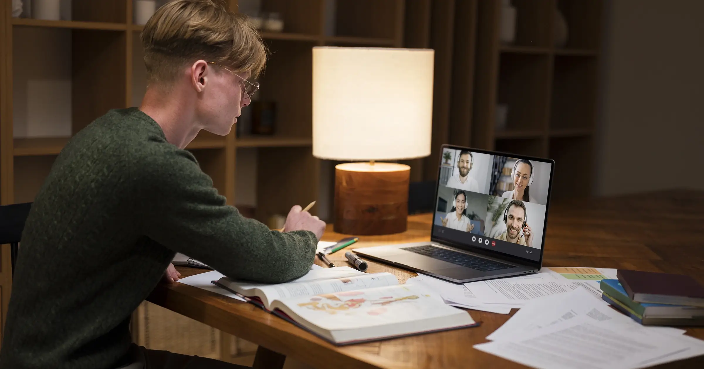 Young man with glasses looking at a screen