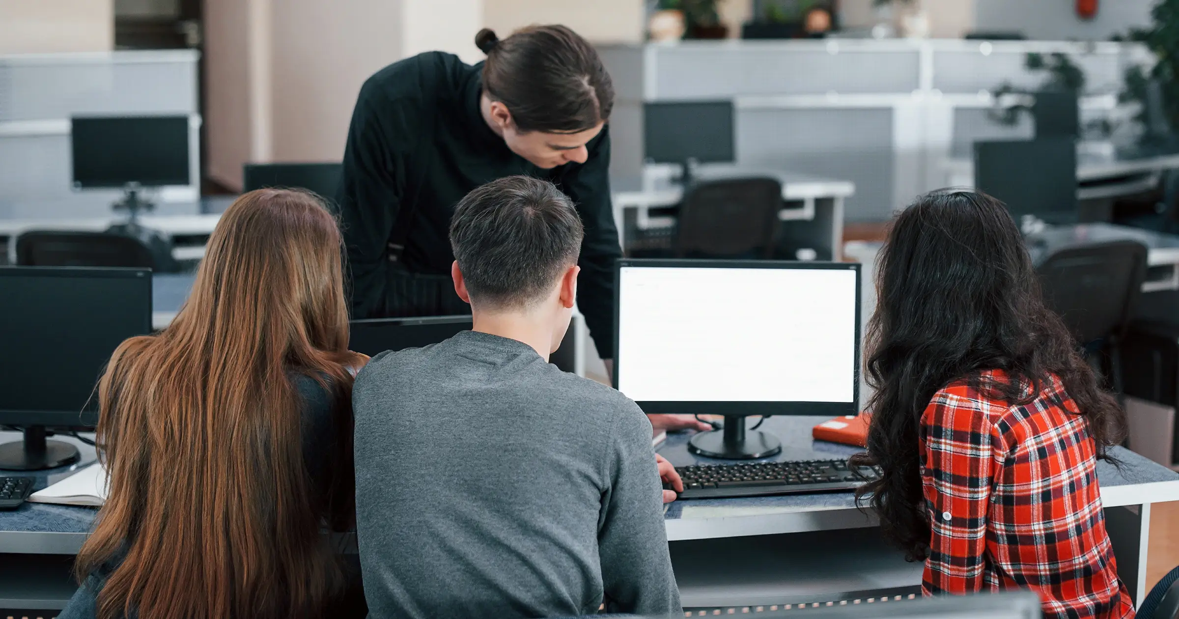 Group of people looking at a screen