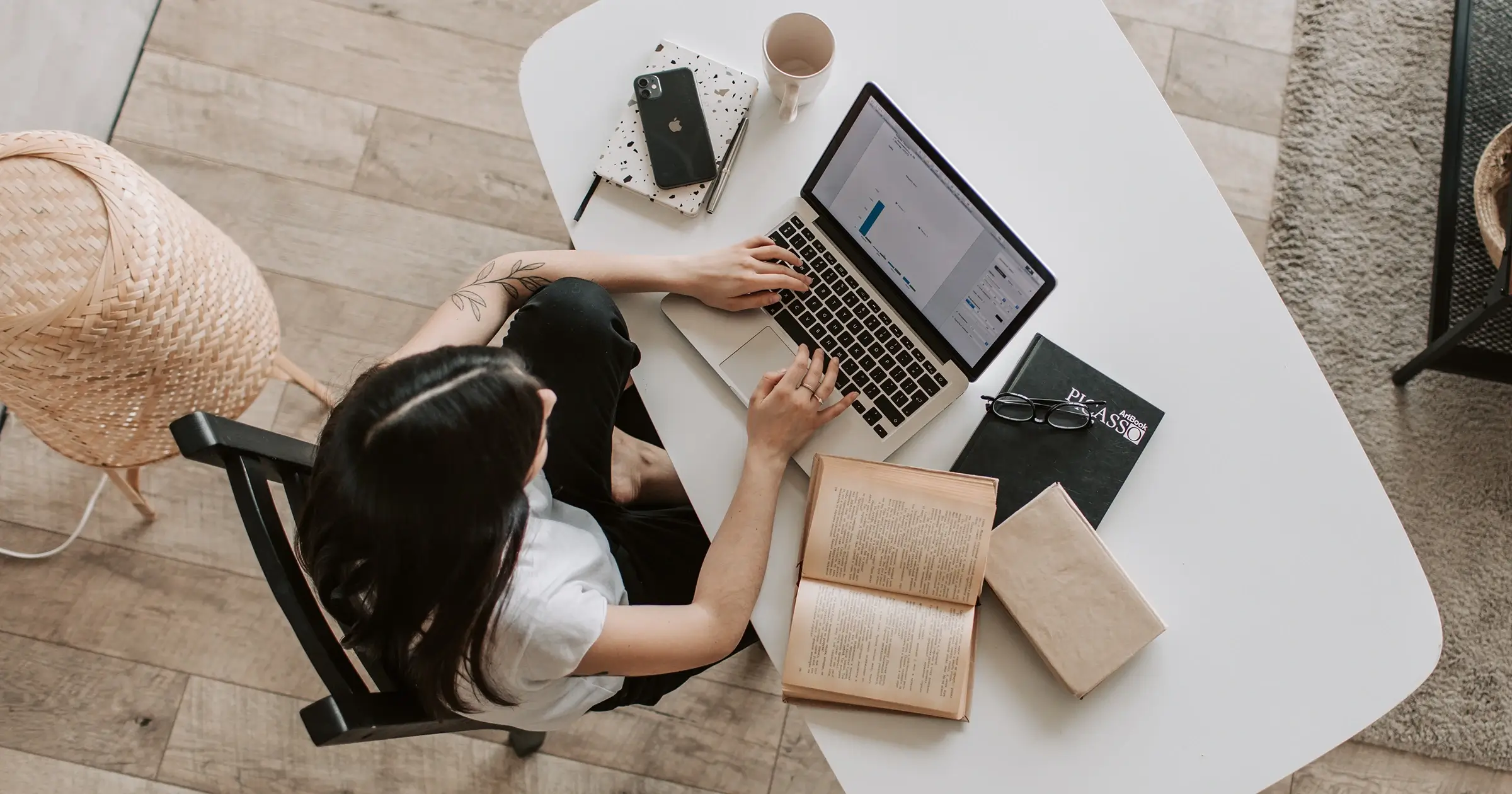 Aerial shot of a girl at her computer