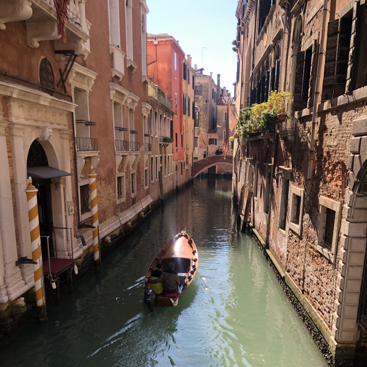 Classic Venice canal view with historic gondolas.