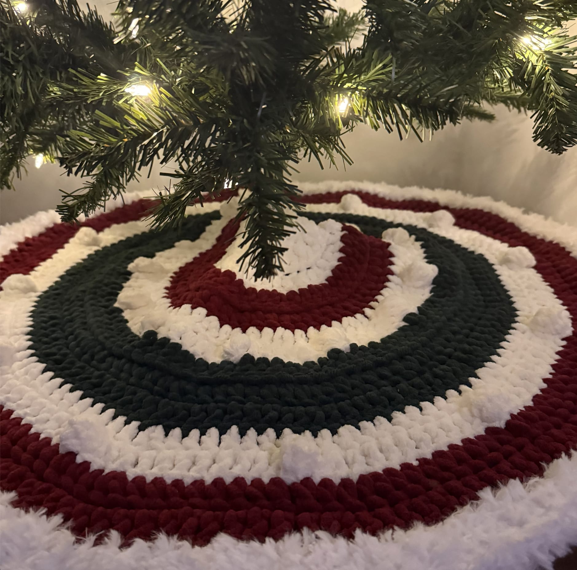 Burgundy, green, and white spiral crochet tree skirt