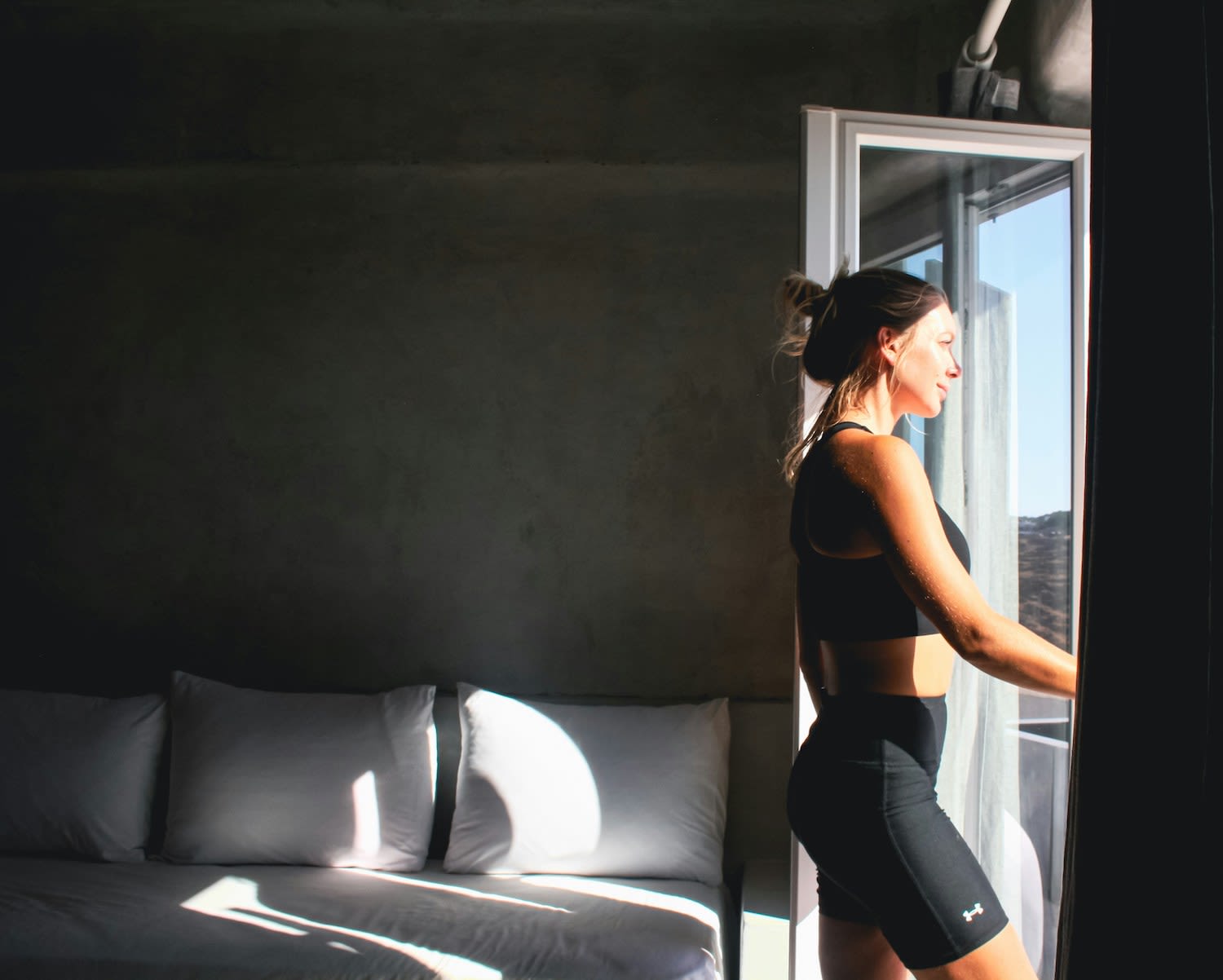 Woman looking out of the window ready for a run