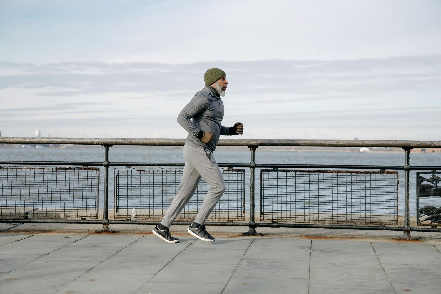 Man Running Near a Cold Lake