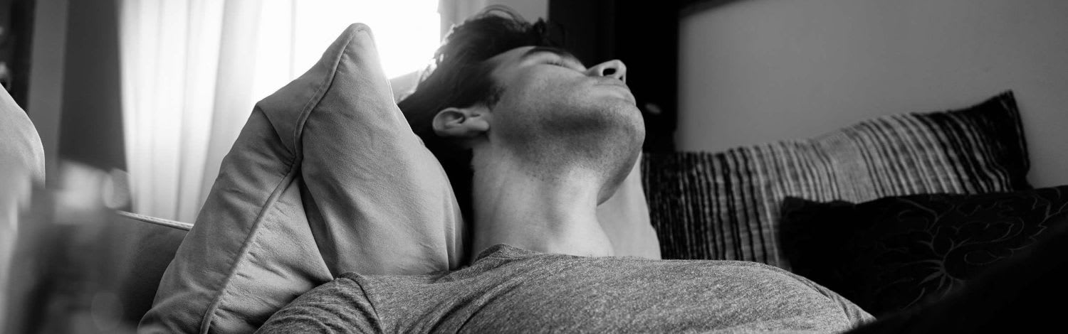 Man on the sofa relaxing after a run