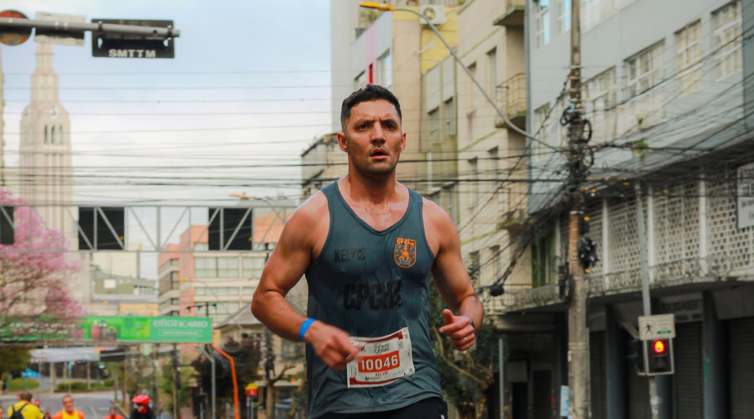 Man running a race to improve his health and heart rate