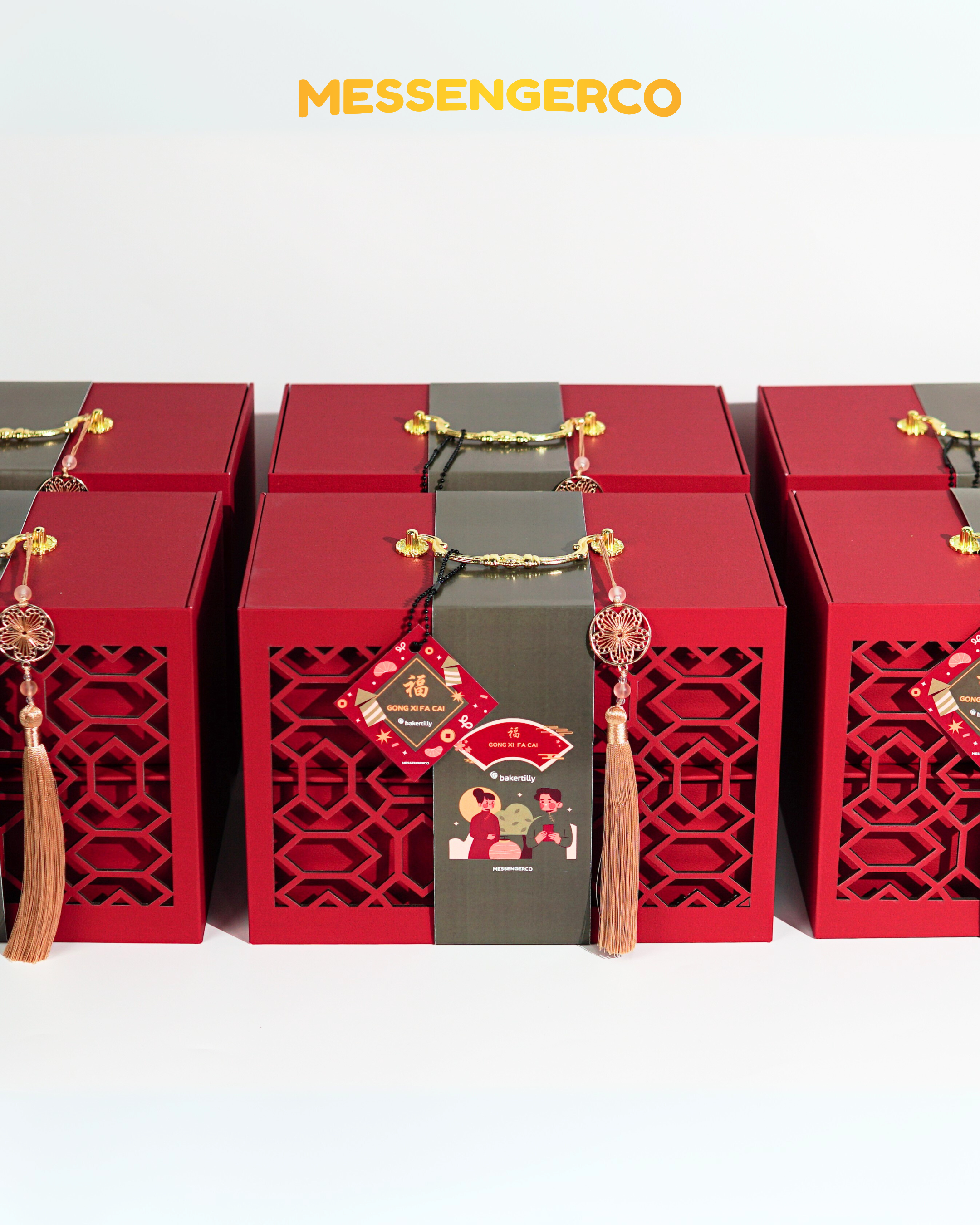 Rows of Imperial CNY gift boxes by Messengerco for Baker Tilly with red box, and gold tassel handles ready for delivery.
