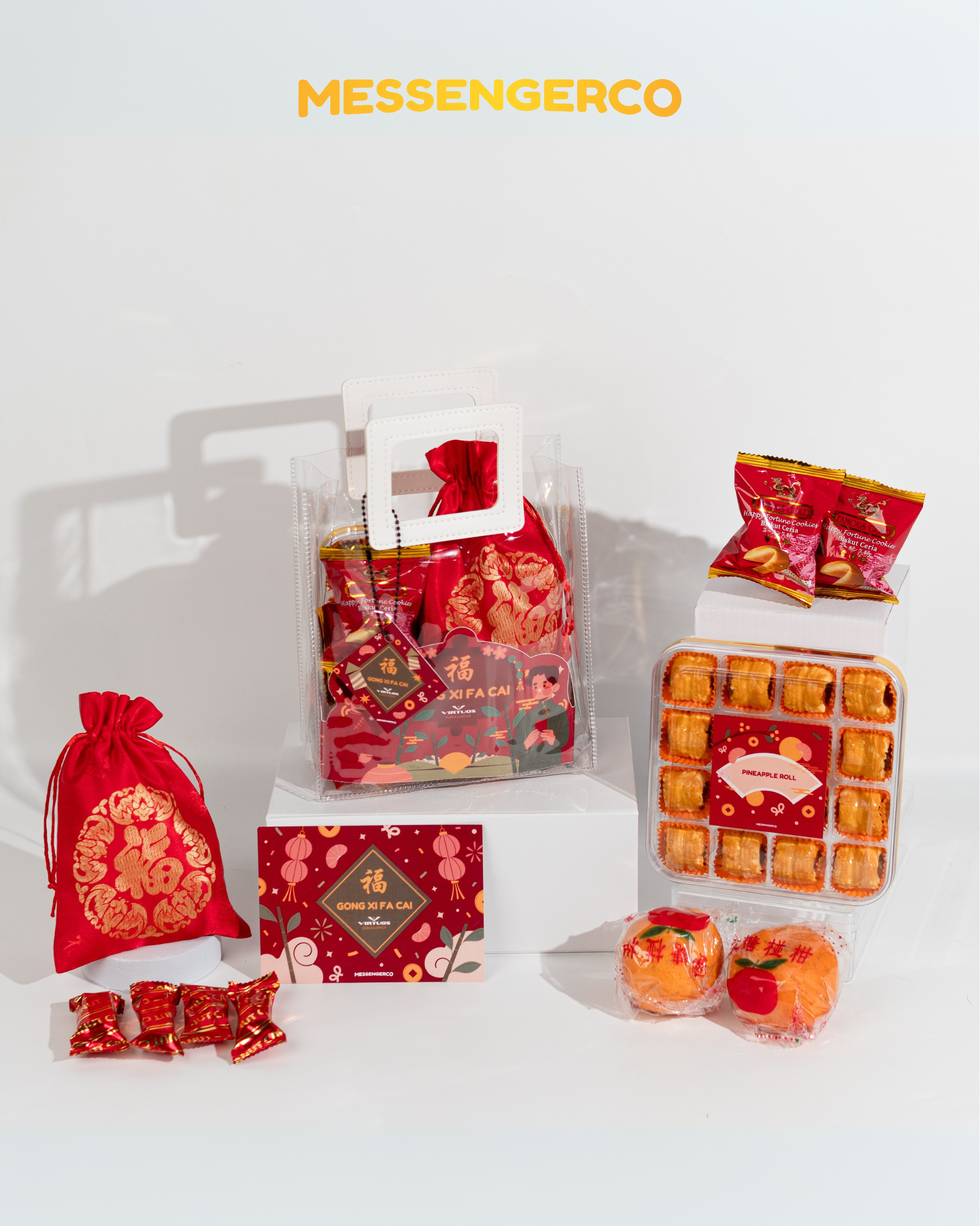 Open Messengerco Care Package CNY gift for Virtuos with clear tote, red drawstring bag, pineapple rolls and greeting card.