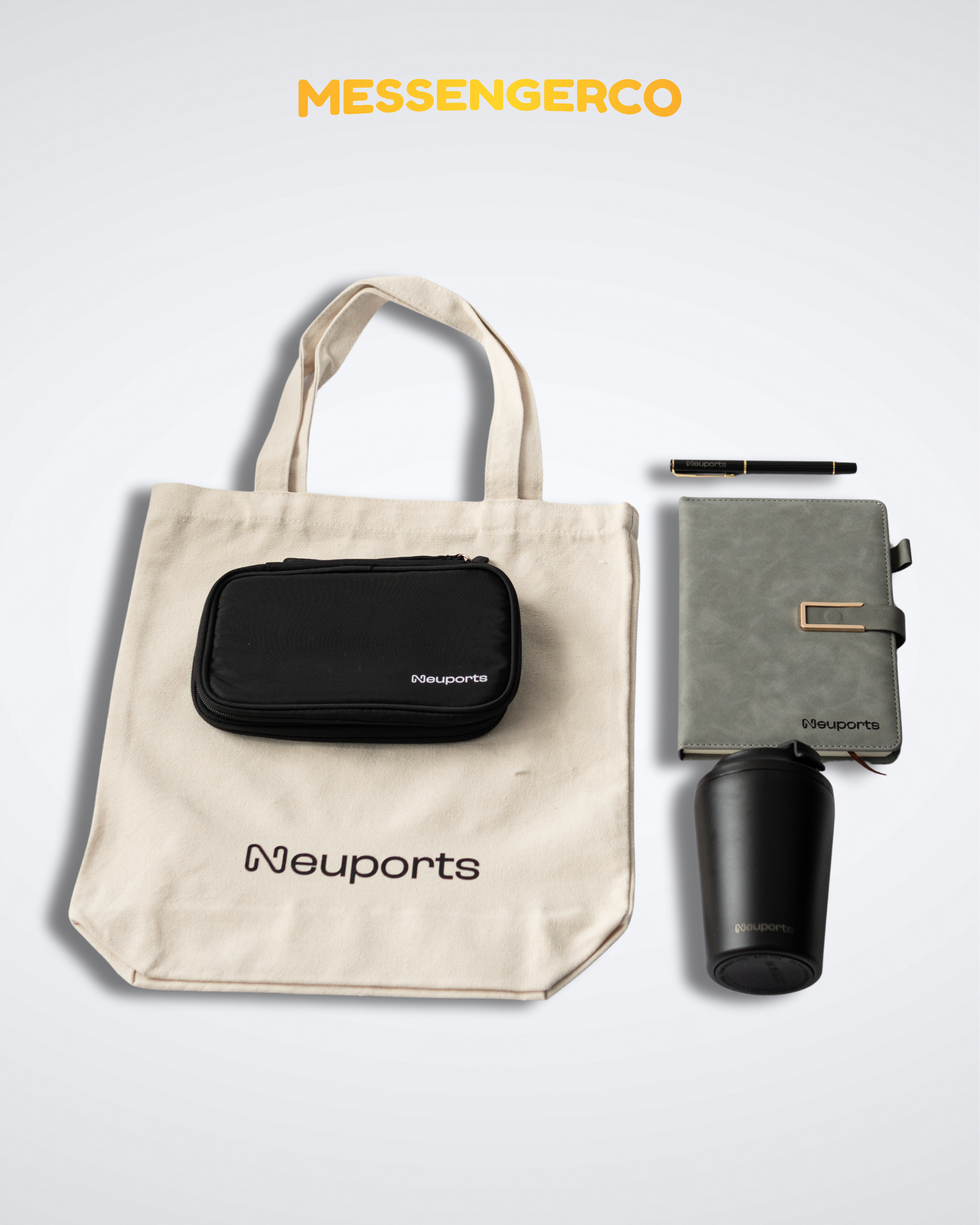 Flat lay of Messengerco welcome kit for Neuports with beige tote, black zip pouch, grey planner, pen and tumbler arranged.