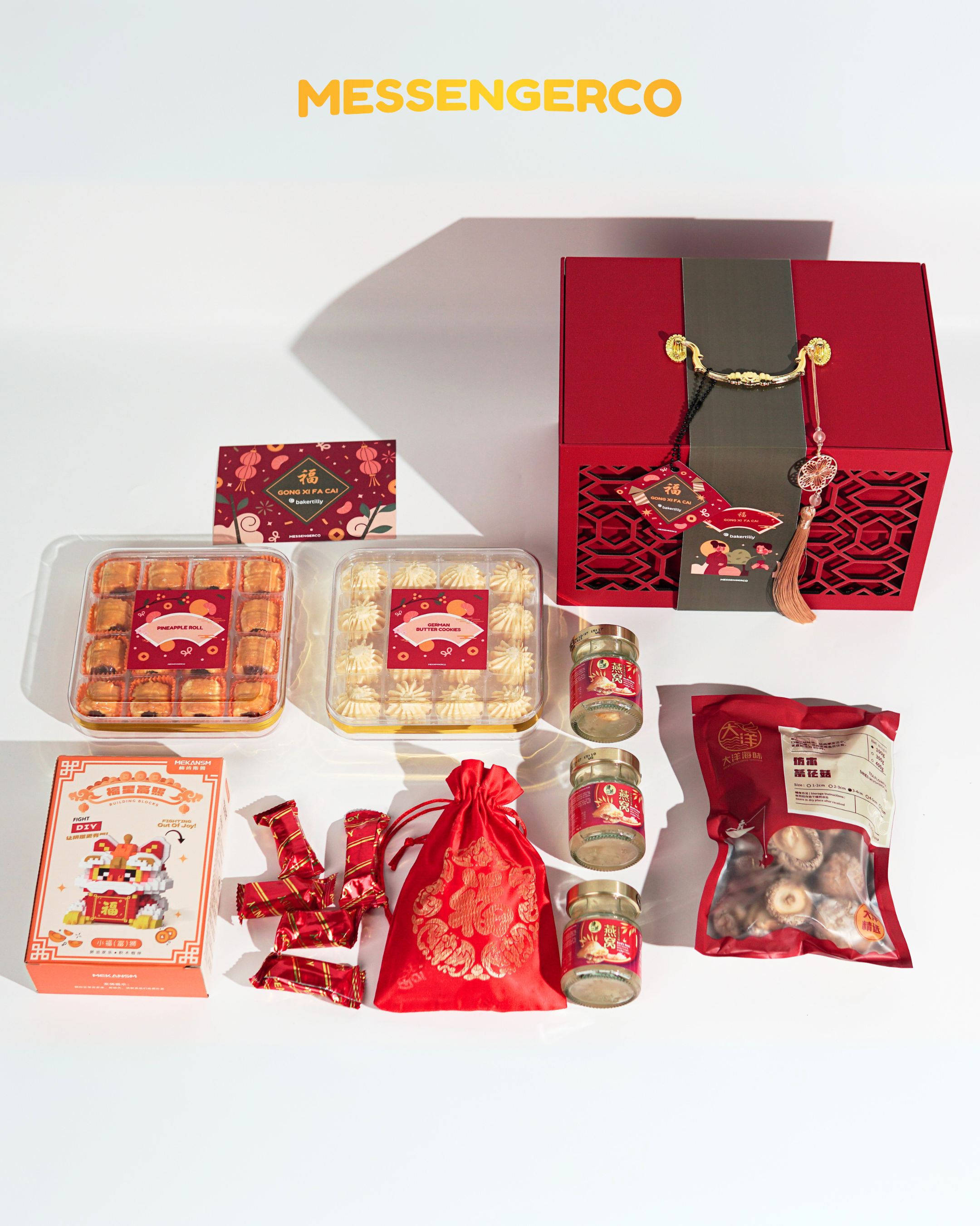 Flat-lay of Messengerco Imperial CNY gift set for Baker Tilly showing festive contents, red box with golden accents, cookies, lego and more.