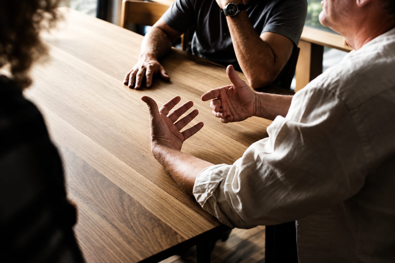 Founders and partners in discussion around a table