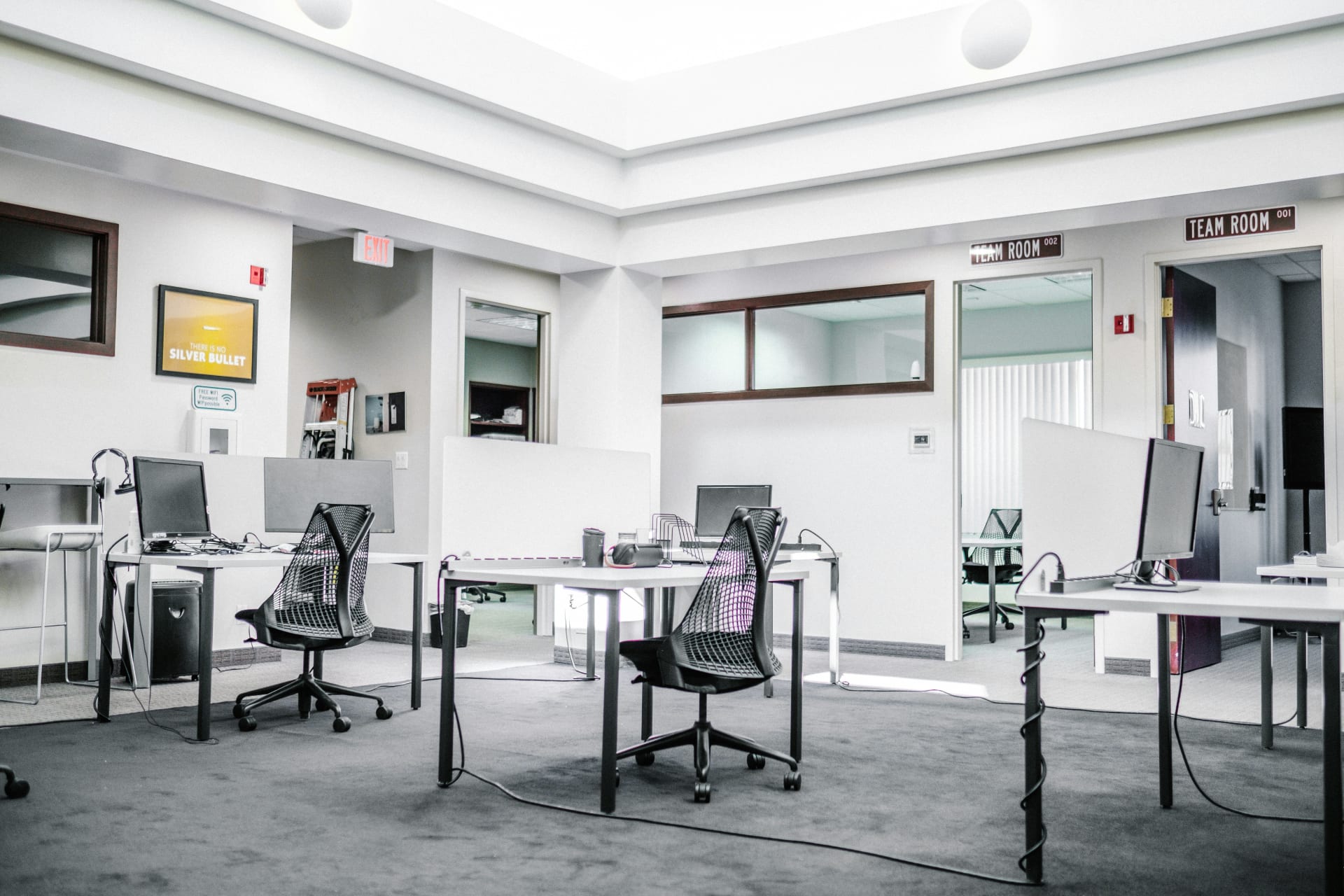 Team gathered around a table in a bright office