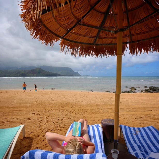 Lounging on beach at St Regis Princeville, Kauai