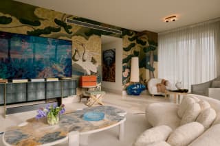 Luxury living room with Asian-inspired murals and designer furniture