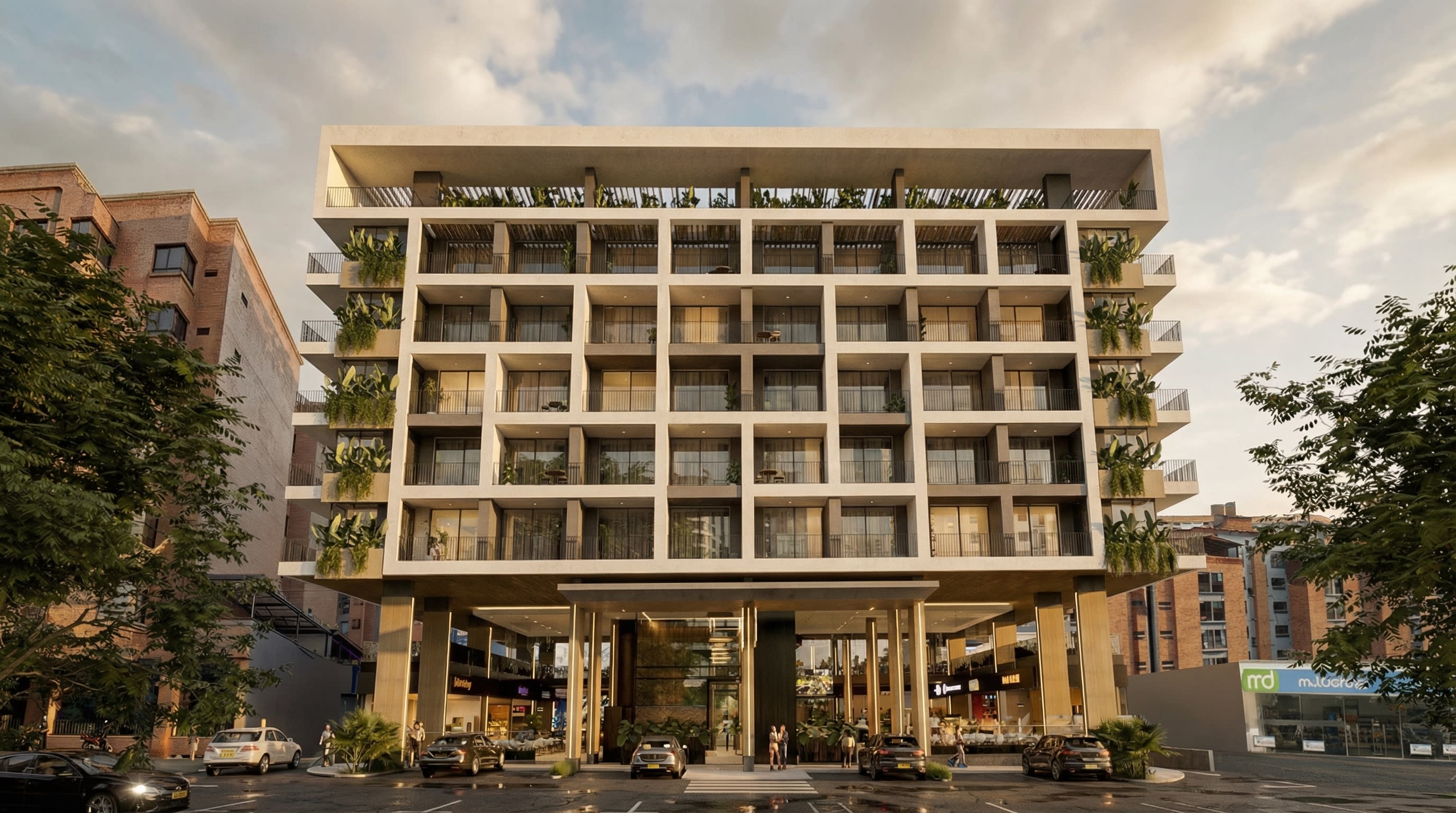 Fachada principal de Volterra Plaza Suites con locales comerciales en planta baja.