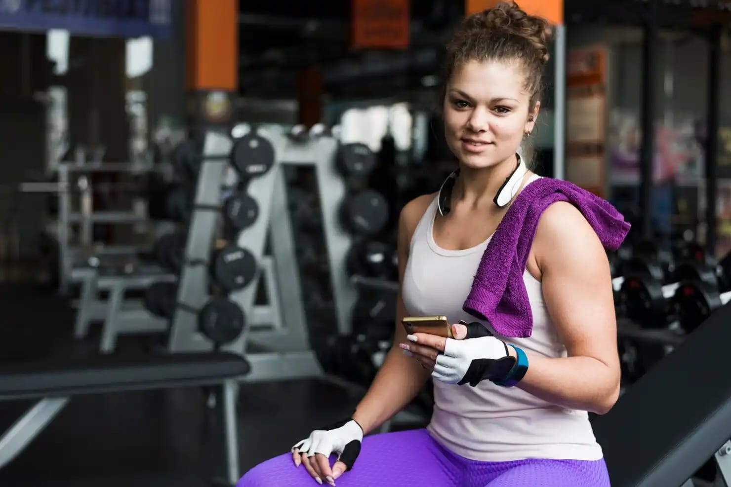 Gym management software dashboard background showing class scheduling and member check-in