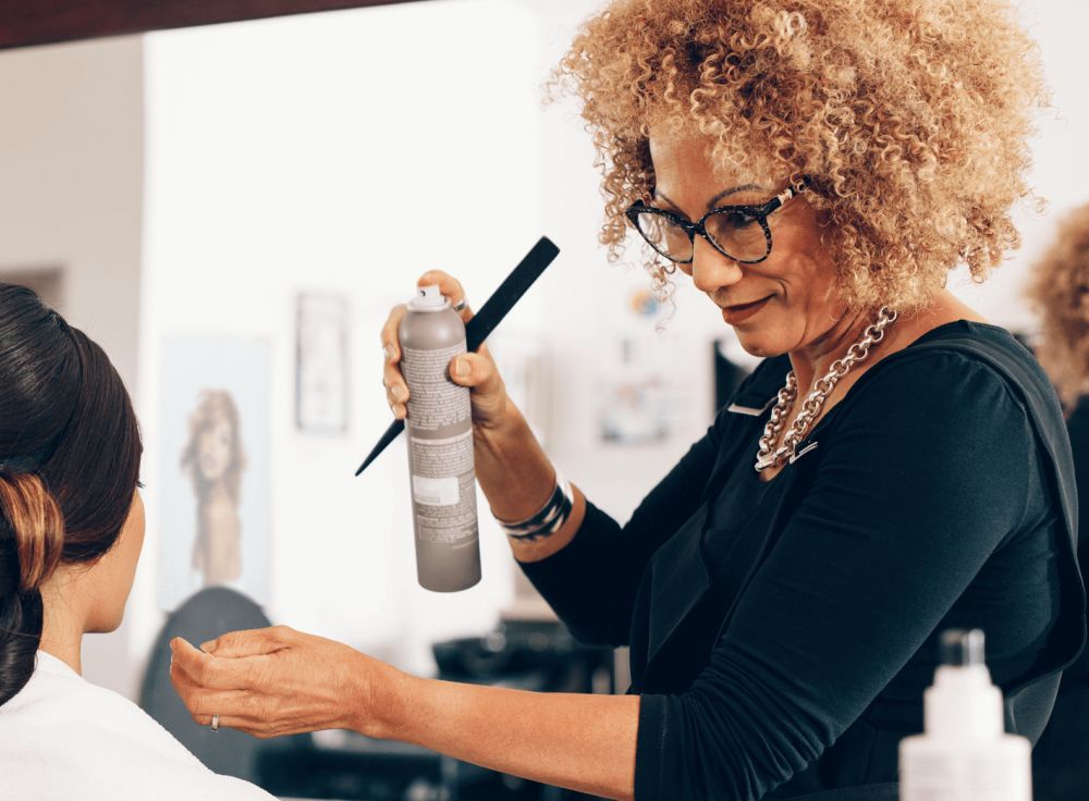 hairdresser doing woman's hair