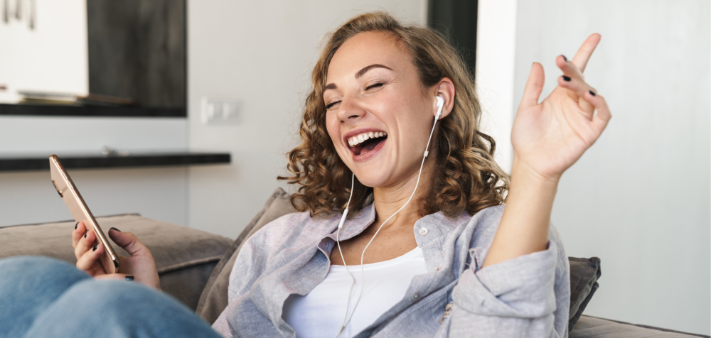 a smiling woman talking on the phone