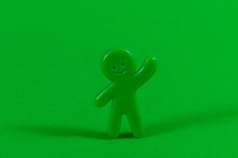 A photo of a waving figure