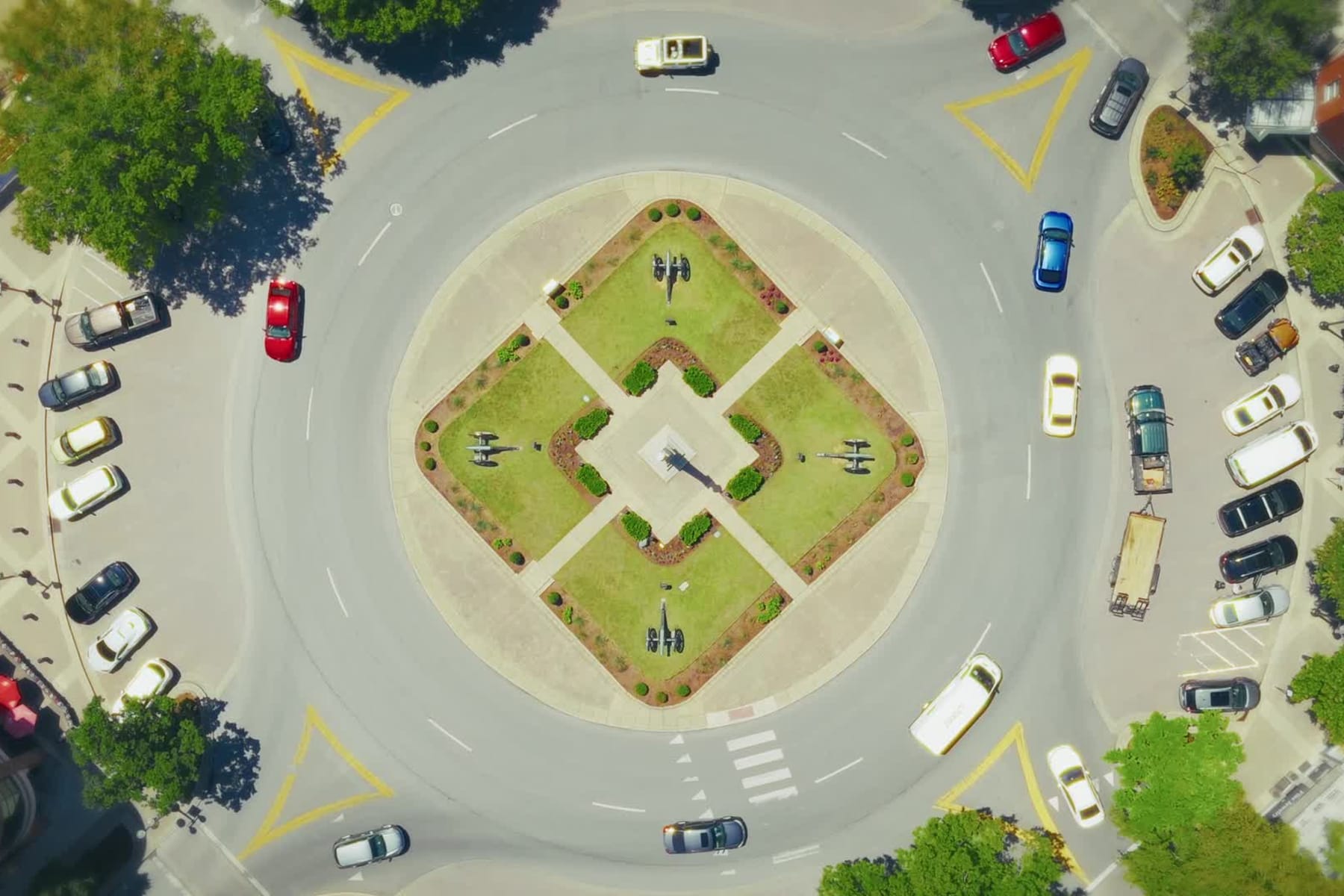The Public Square in downtown Franklin seen straight down from a drone on an ordinary afternoon: the monument at the center of the roundabout, cars on the circle, and Main Street running off to the left