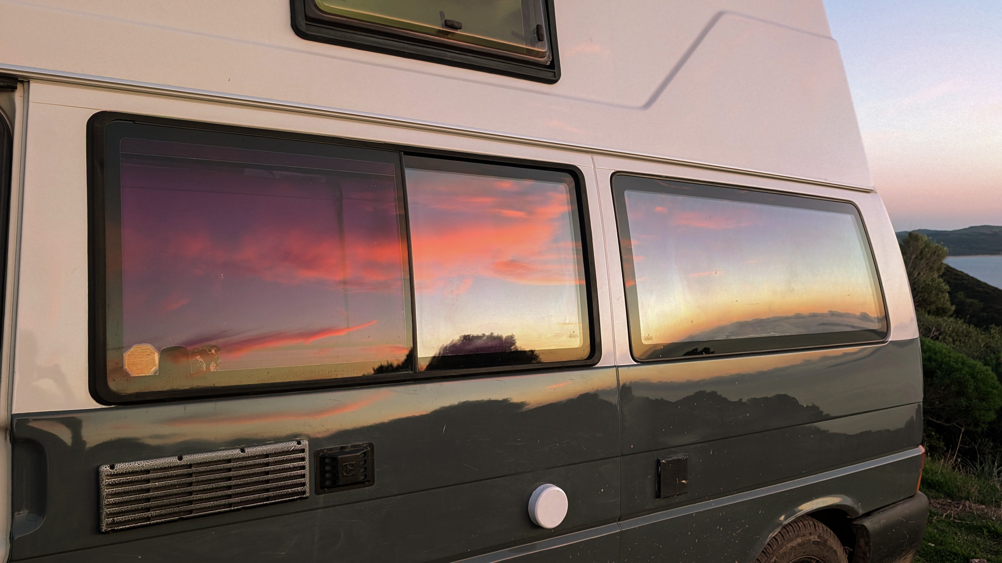 Sunset reflected from the van