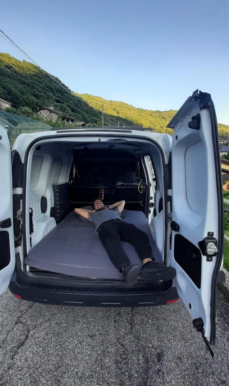 The mattress placed inside the still-empty van