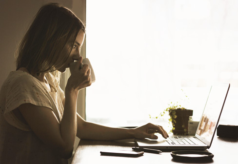 savings plan, woman behind computer