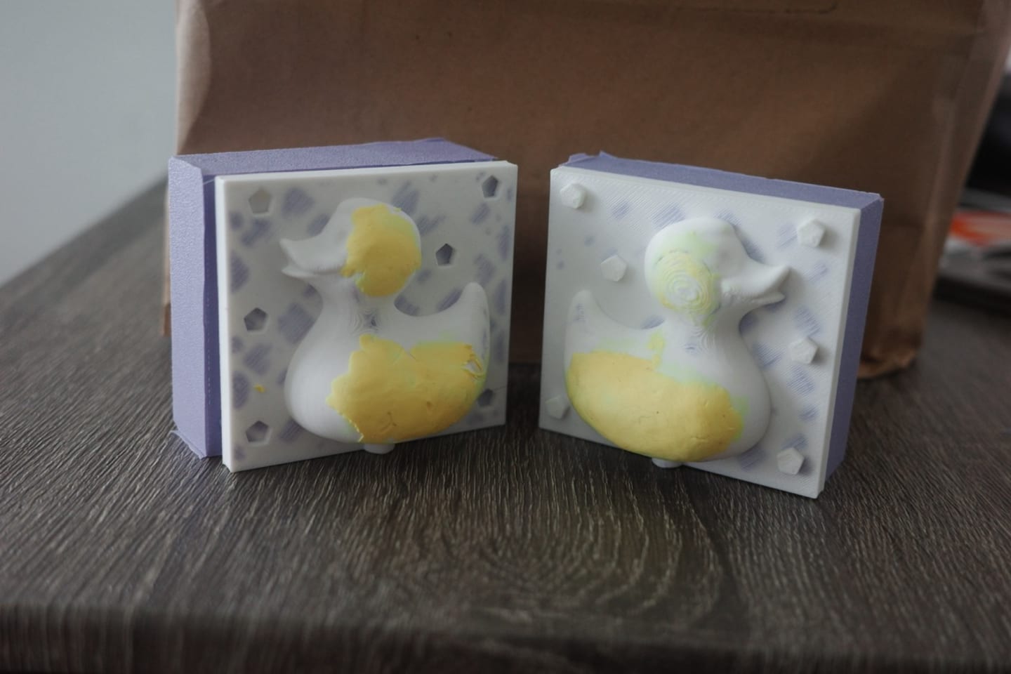 Photo of the two mold of molds with the actual box relief.