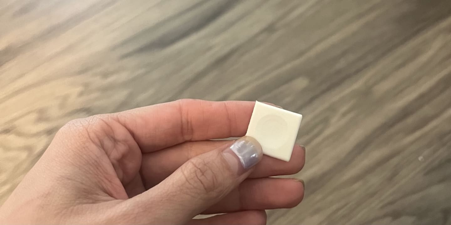 Photo of celina holding a 3d printed keycap with dished out centre