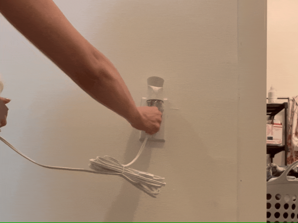 animated gif of celina testing the lightbulb brightness