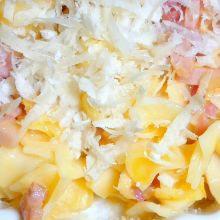 Mit Käse bestreuen