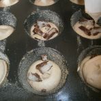 Filling in the muffin baking dishes