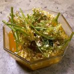 Elderflower blossoms with orange juice