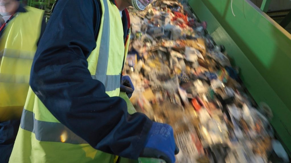 a guy recycling trash