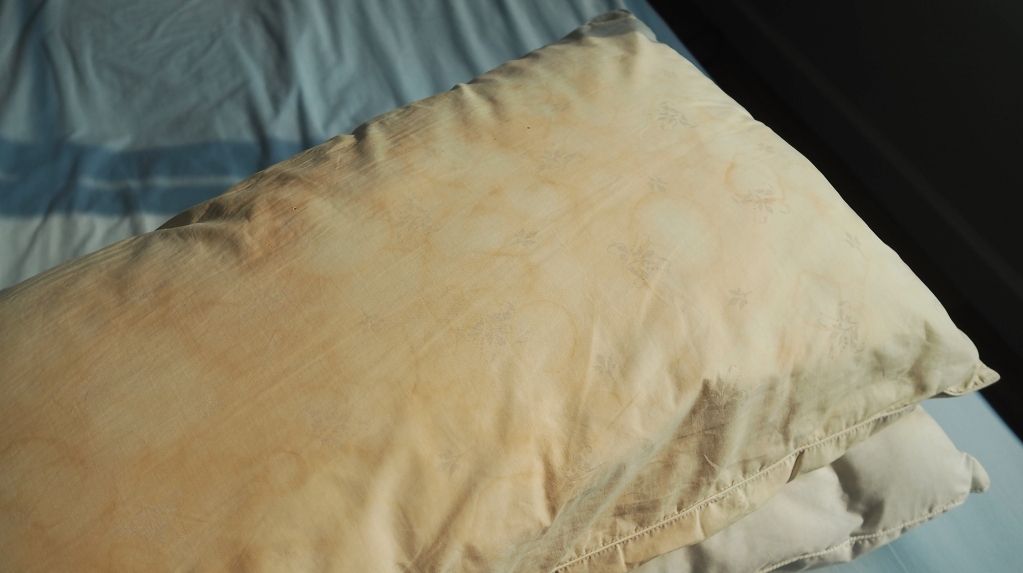 dirty pillows on the bed