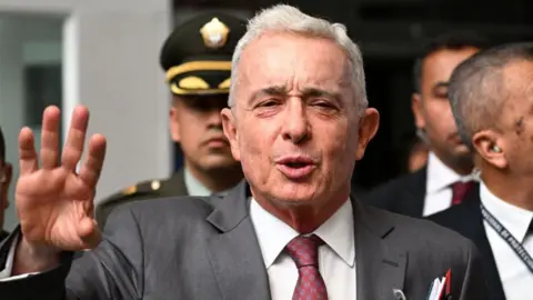 "former Colombian President Álvaro Uribe Sentenced To 12 Years House Arrest For Witness Bribery"