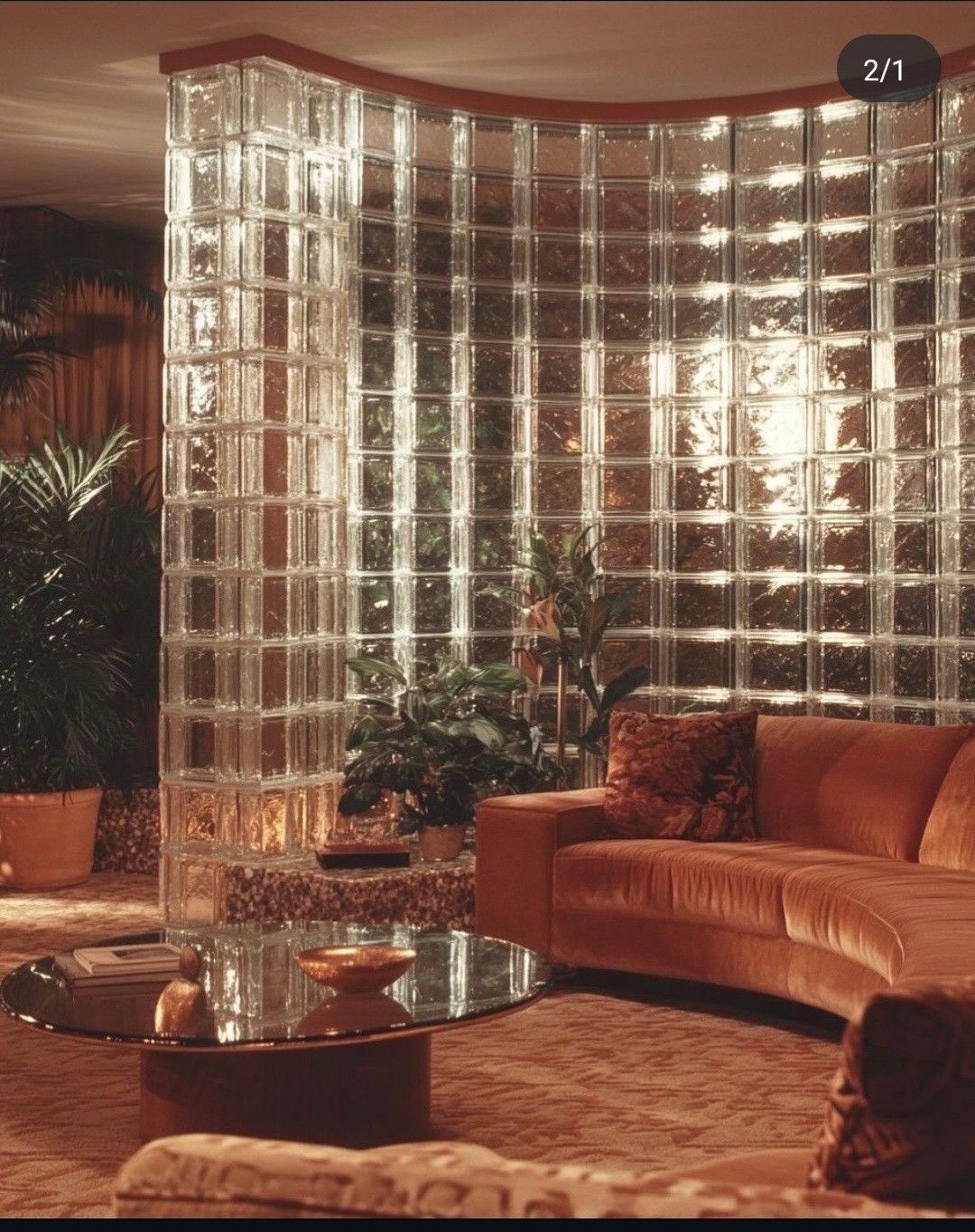 70s living room with glass block wall, velvet sofa