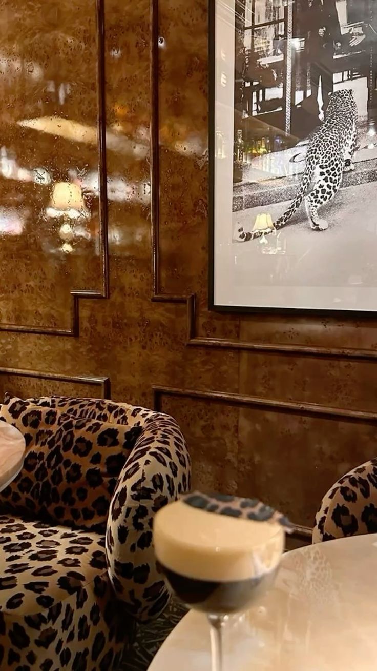 Leopard print sofa, burl wood walls
