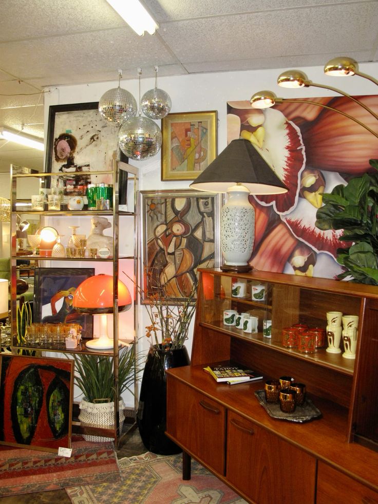 Vintage MCM store with teak furniture and lamps