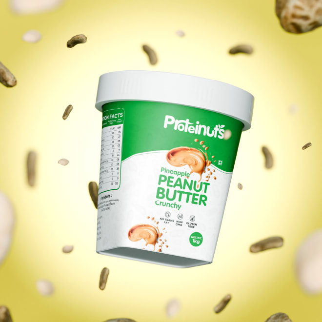 Proteinuts peanut butter tub surrounded by floating peanuts