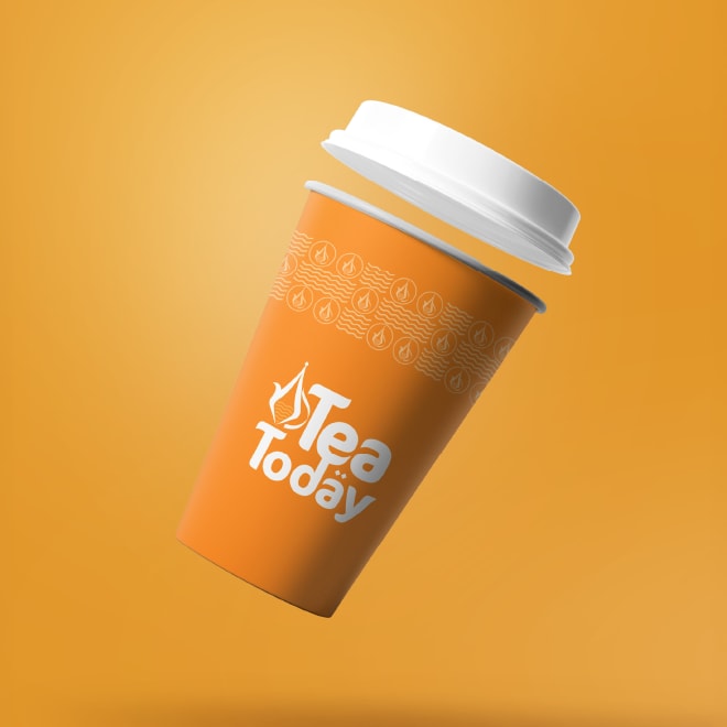 Tea Today orange takeaway cup floating on orange
