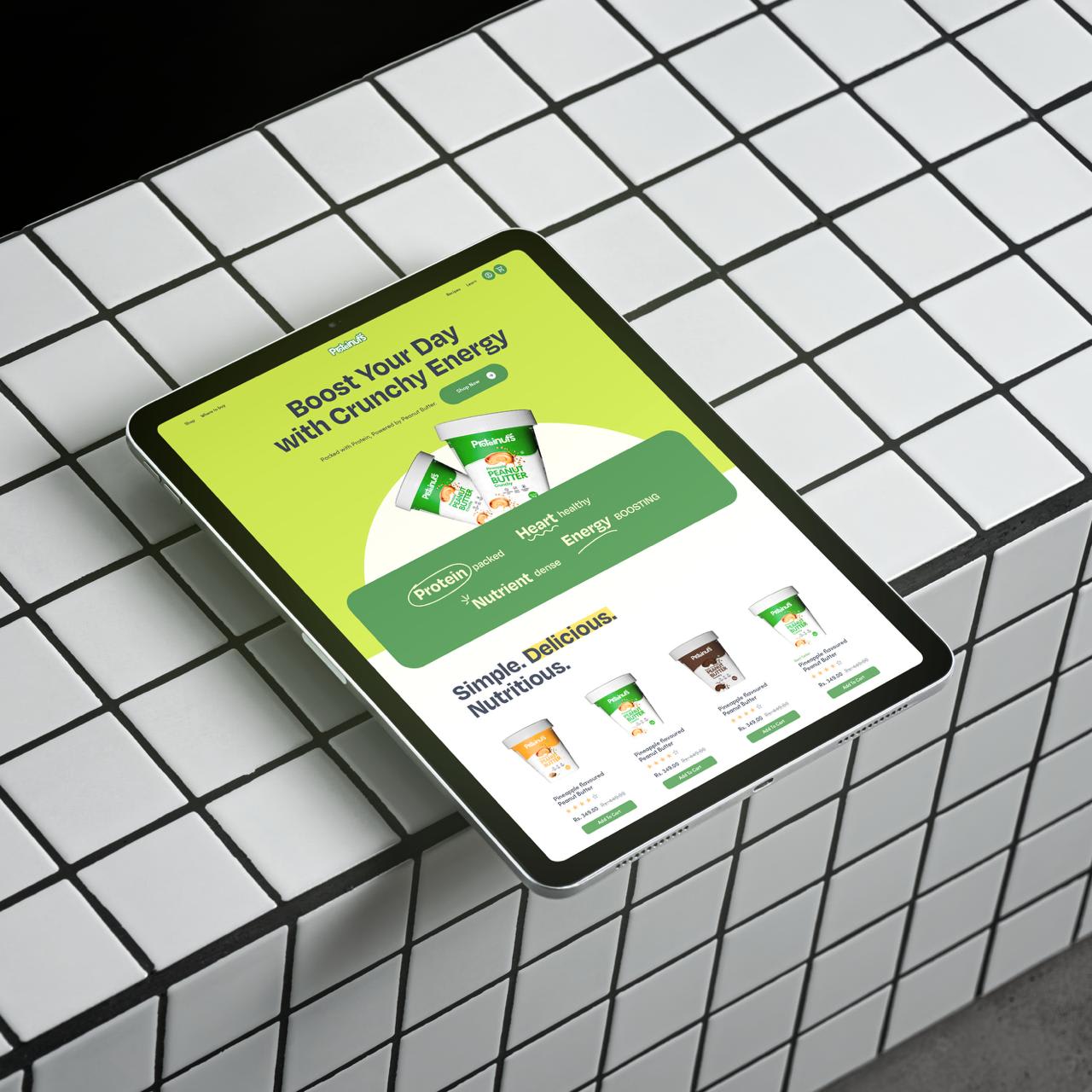 Proteinuts storefront on a tablet over a tiled grid