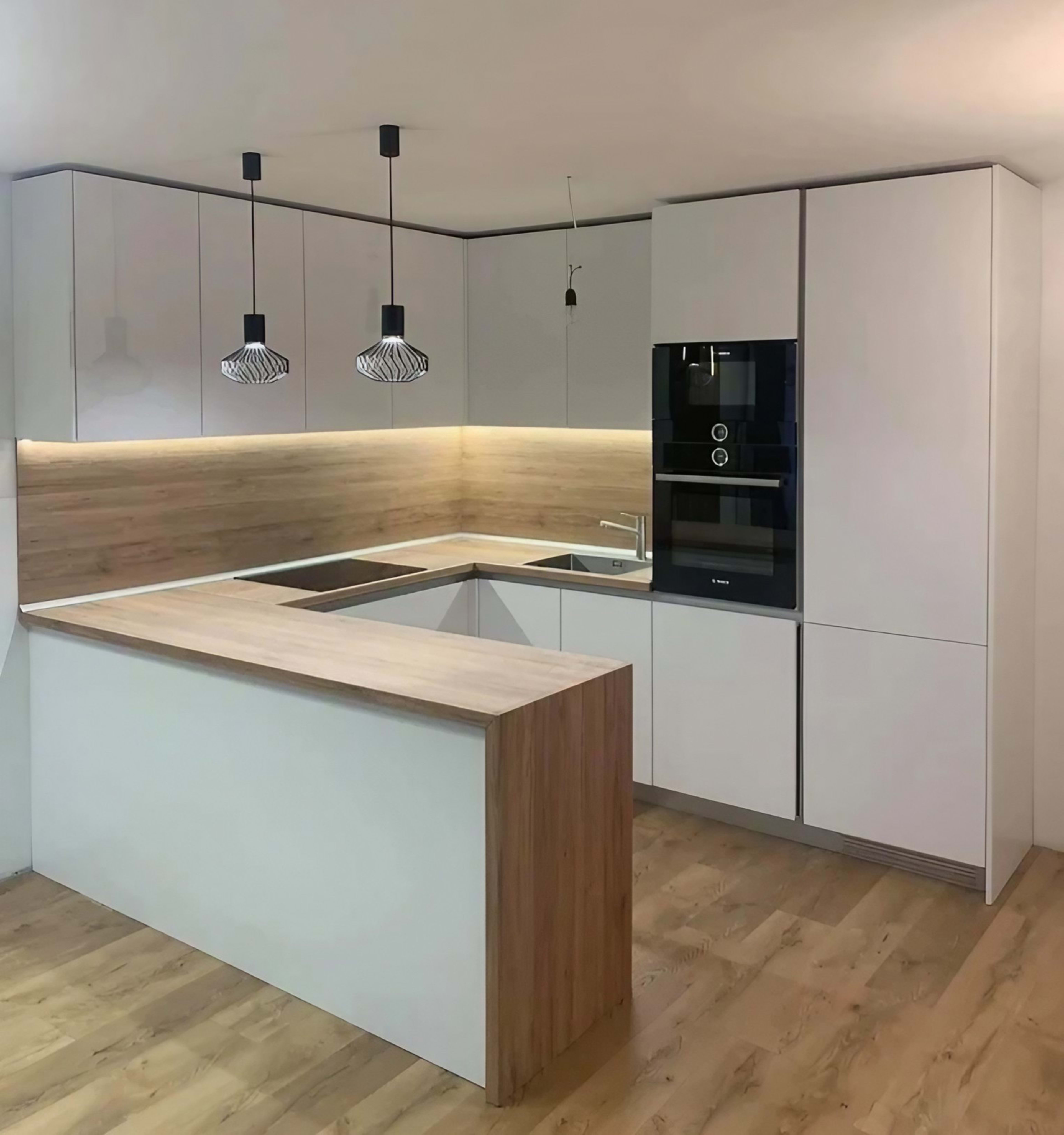 Modern white kitchen with peninsula