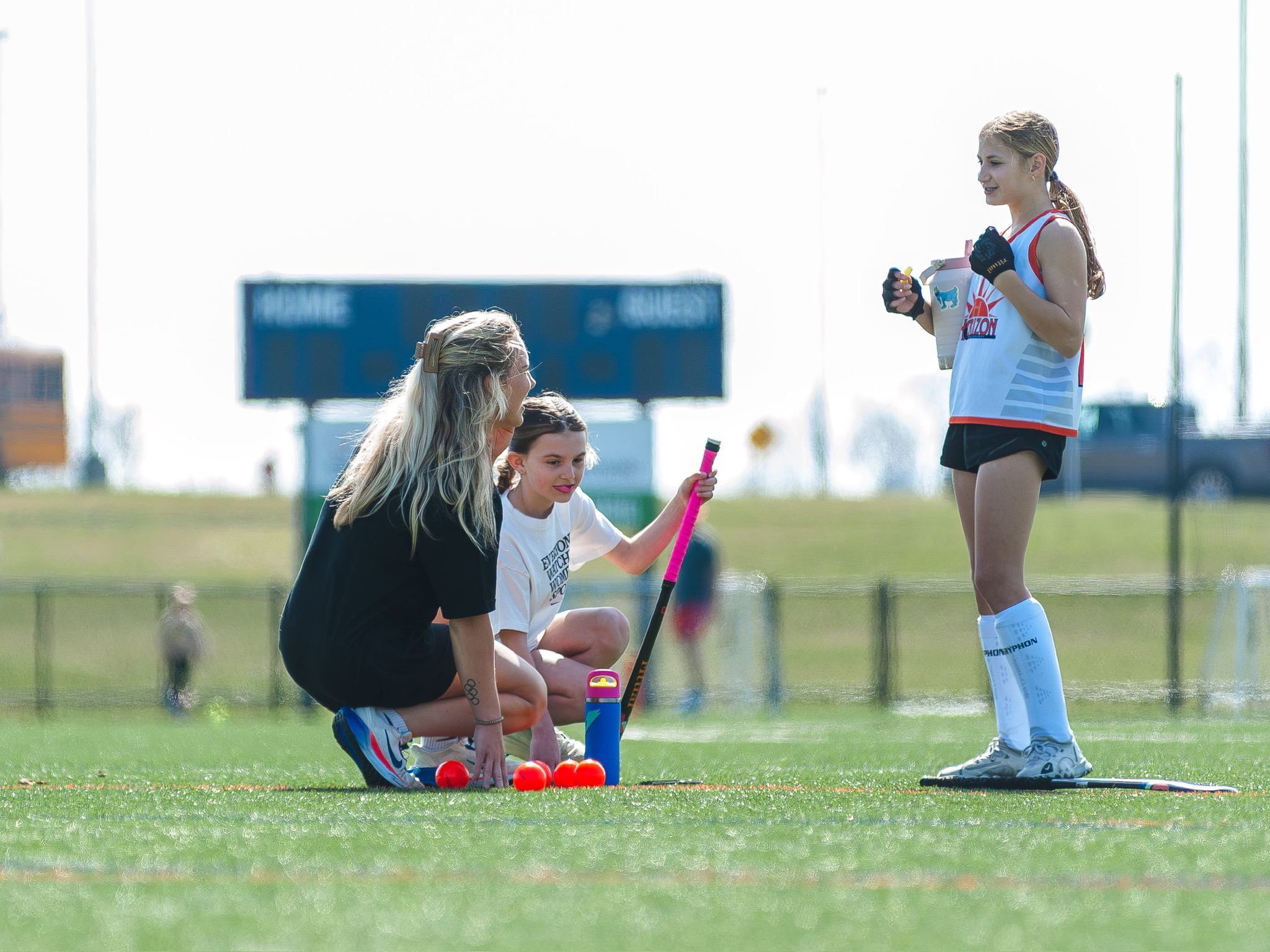 Phia coaching young athletes