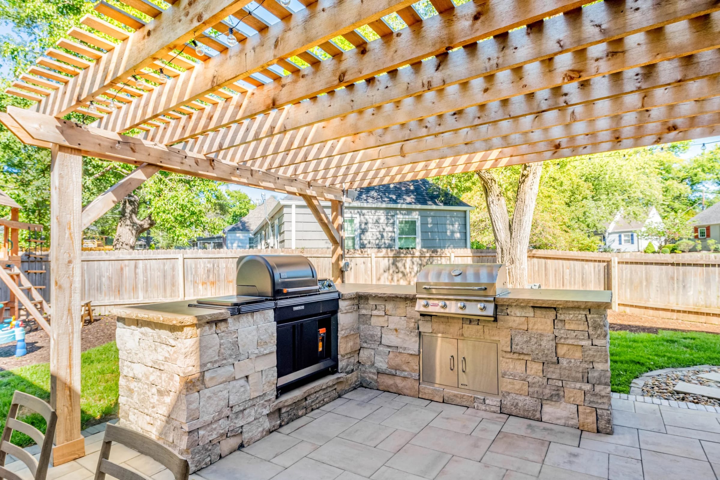 Custom cedar pergola with fire feature and outdoor living build